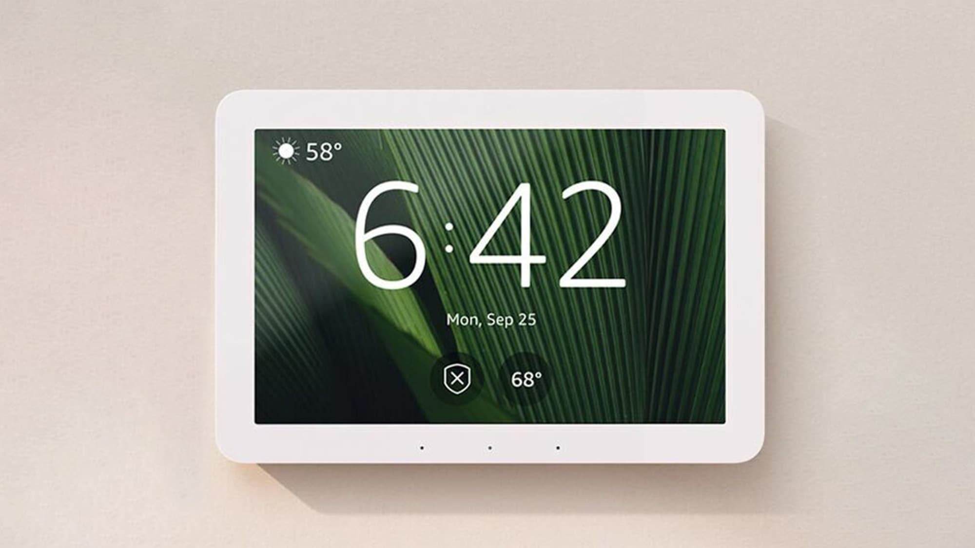Amazon Echo Hub mounted on a wall showing a smart home control dashboard
