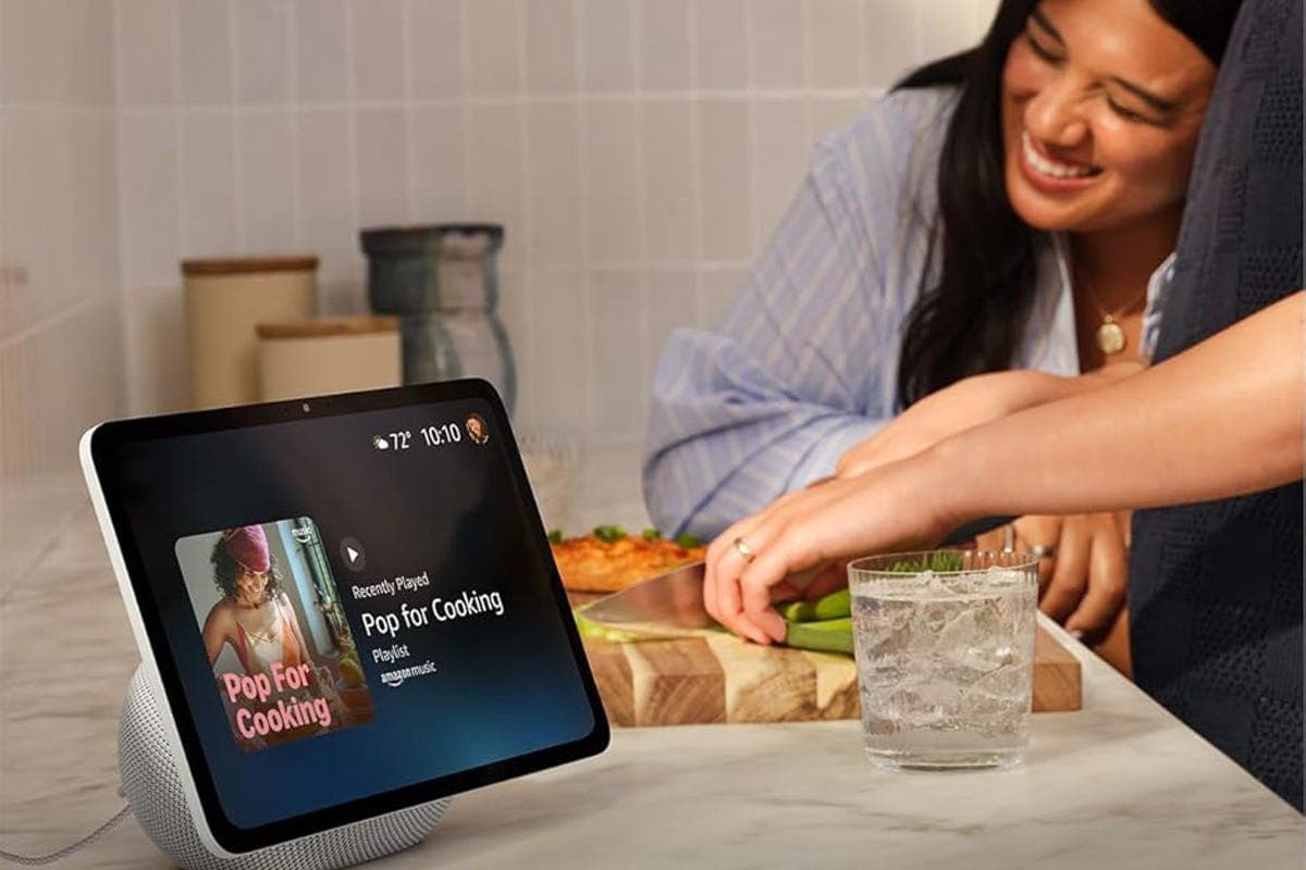 An Echo Show smart display showing a camera feed on a kitchen counter