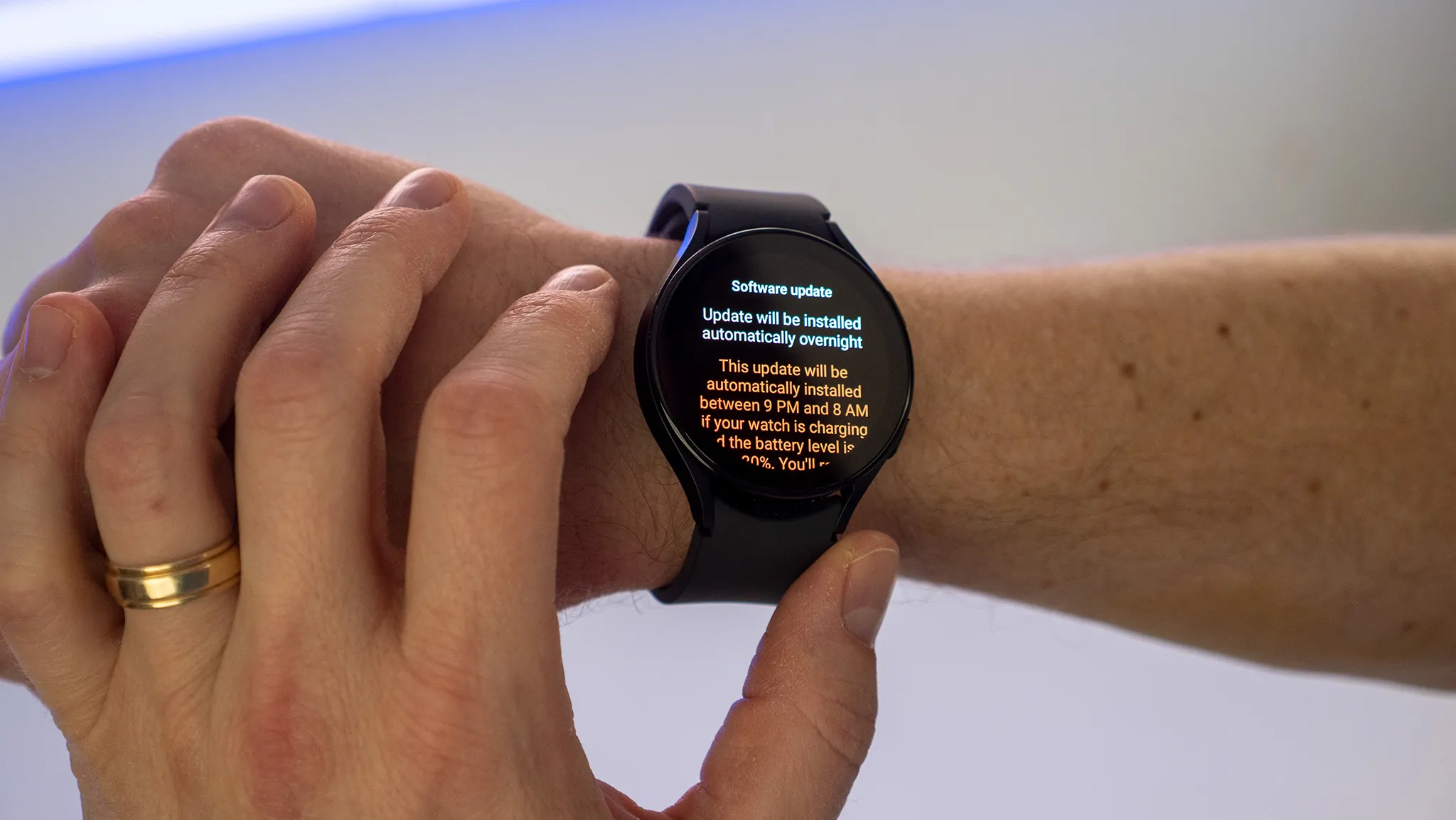 A Galaxy Watch showing SmartThings camera feeds from Nest and Ring cameras on the watch screen