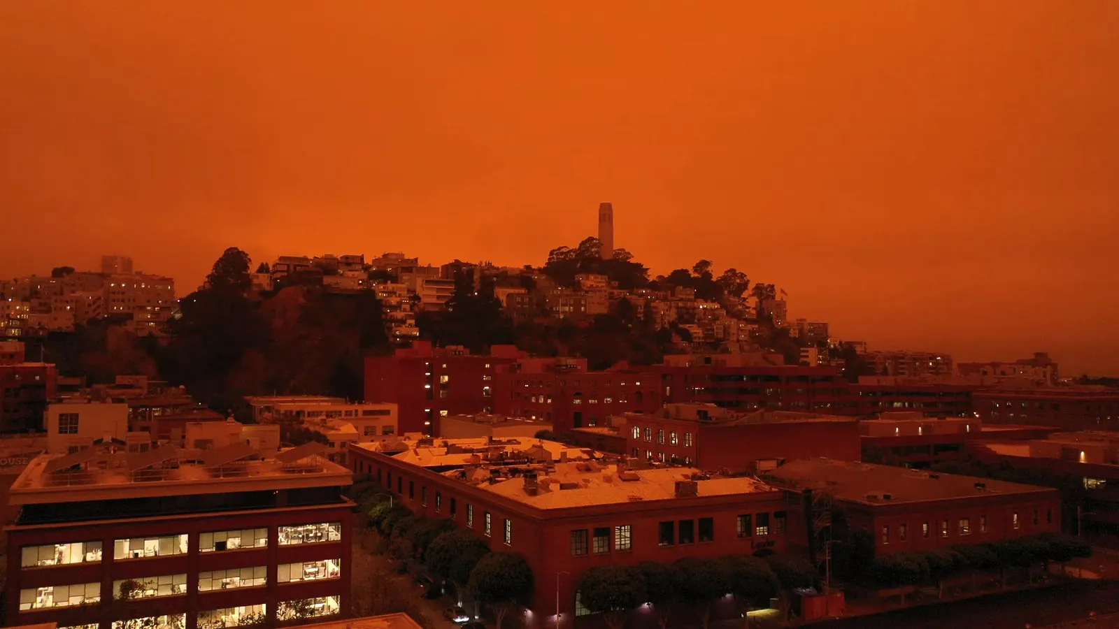 San Francisco Bay Area under an orange smoke-filled wildfire sky