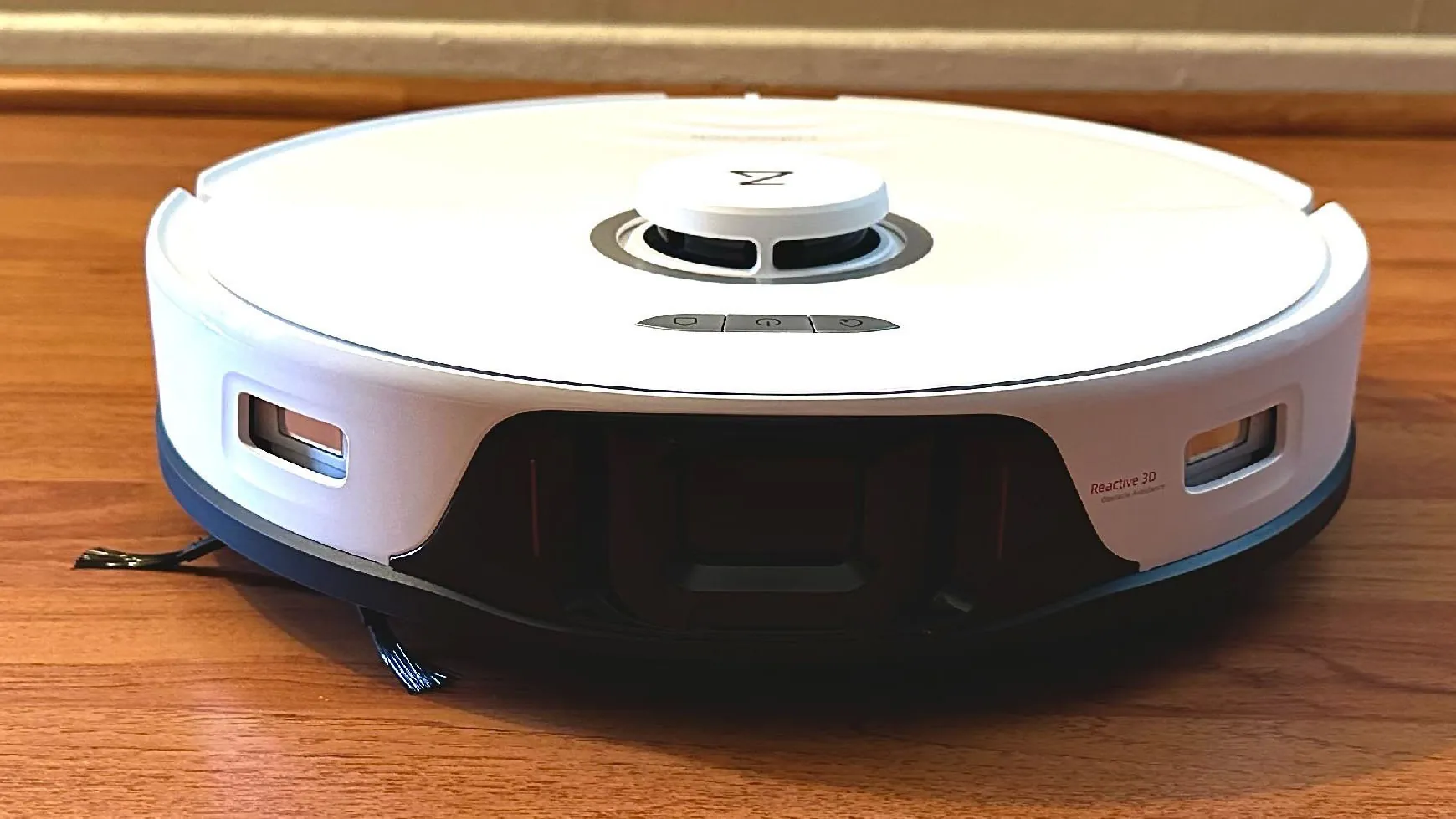White Roborock S8 Pro Ultra robot vacuum with a round top sensor turret in a bright home interior