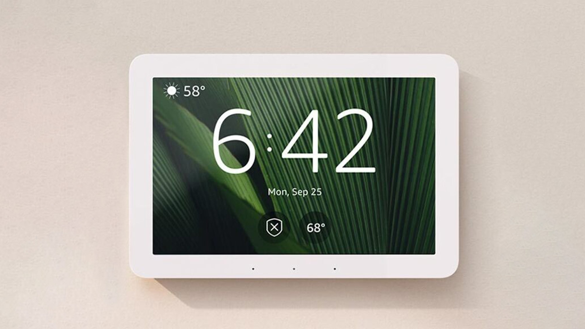 Amazon Echo Hub mounted on a wall showing a smart home control dashboard