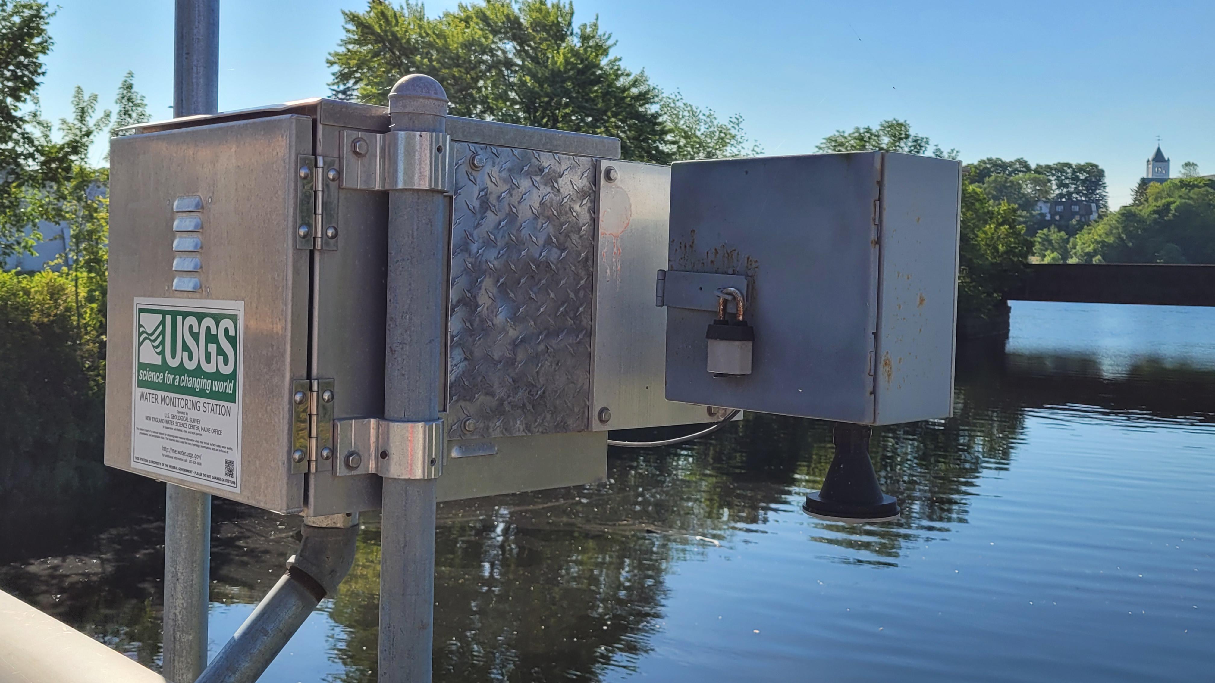 NOAA river gauge station installed along a riverbank