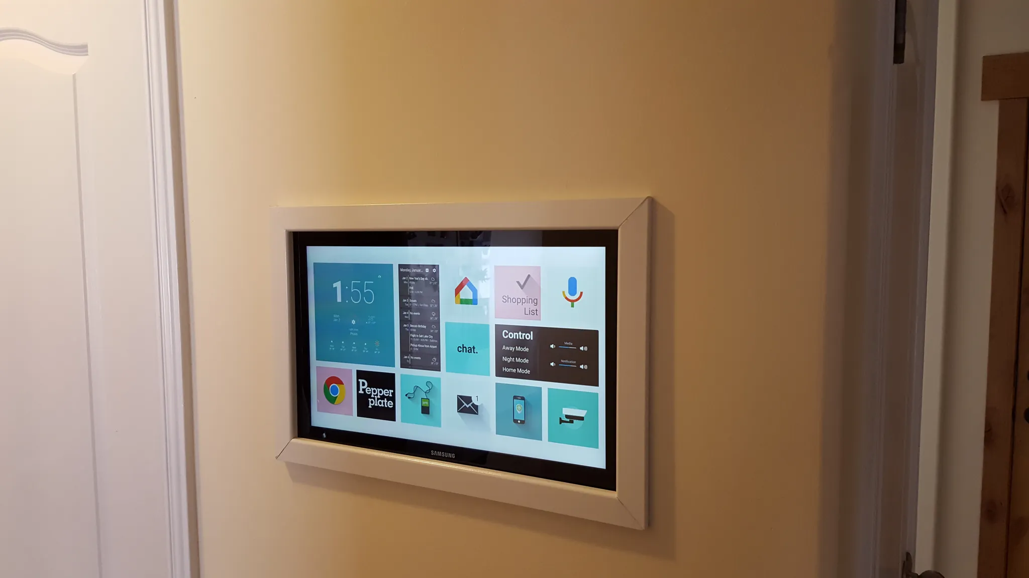 Large tablet recessed into a wall as a permanent smart home control panel