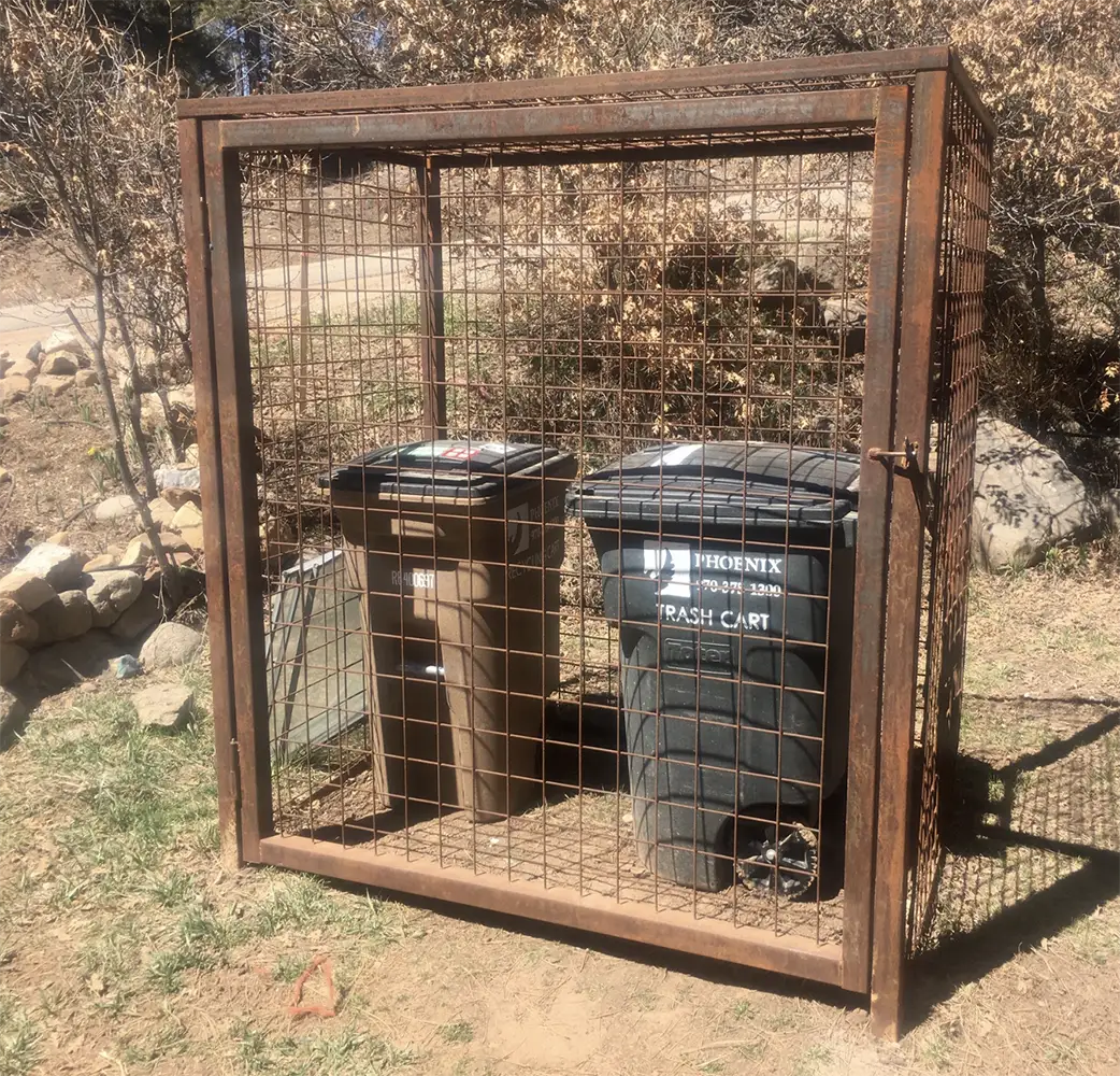 Bear-resistant wheeled trash carts in a residential outdoor setting