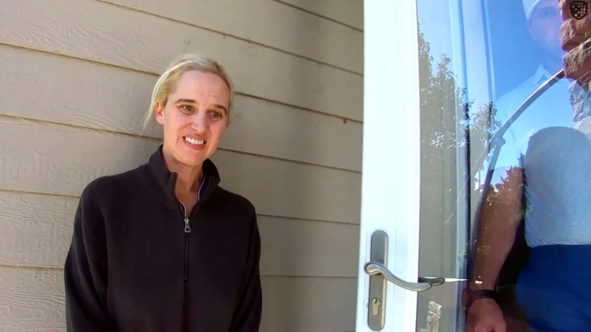 Chrisanna Elser standing beside her parked truck after being wrongfully suspected based on ALPR data