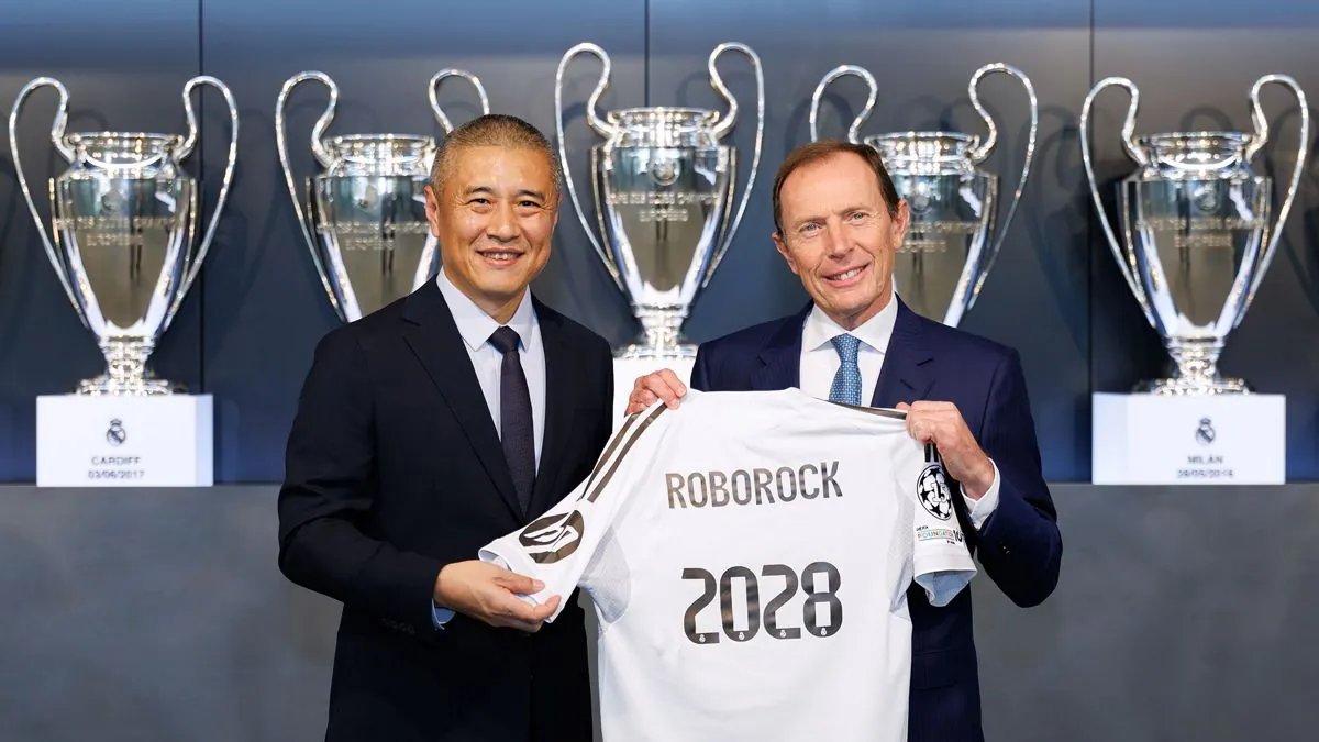Roborock and Real Madrid executives signing the partnership agreement at Real Madrid City